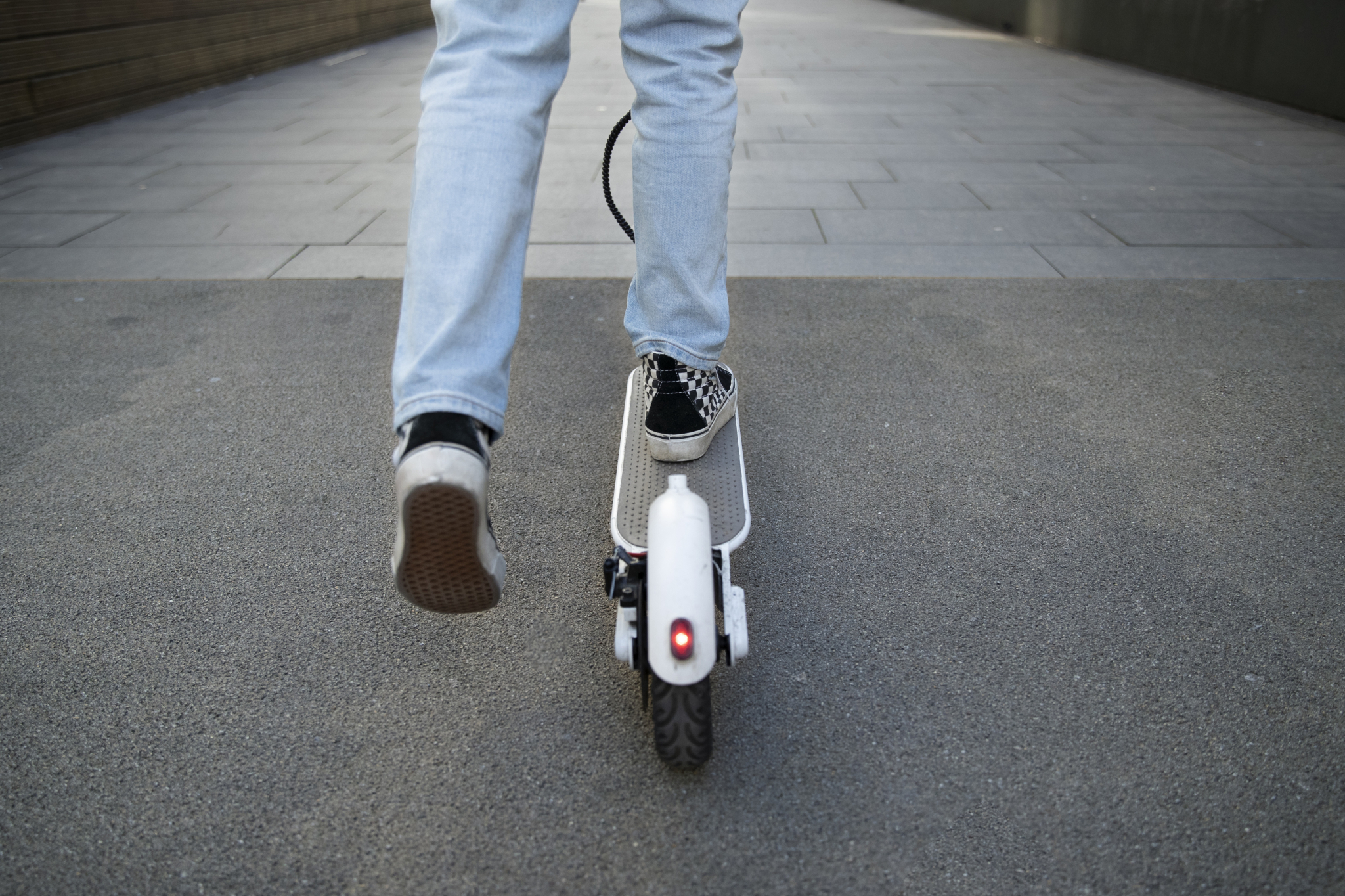 Back view young person electric scooter
